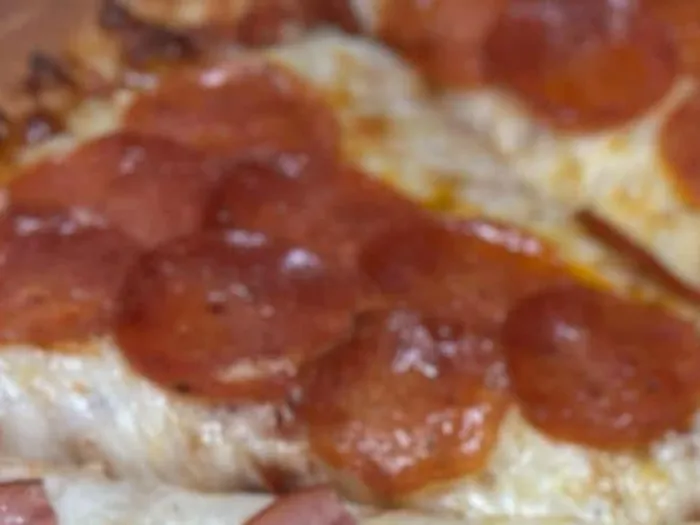 R7 pepperoni pizza with cupped pepperoni over melted cheese
